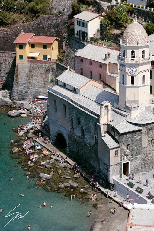 Photo of the coastline and church with bell tower in Vernazza, Cinque Terre, Italy. By Photographer Scott Allen Wilson.