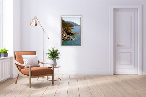 The bright room with parquet flooring is completed by Photographer Scott Allen Wilson’s print of Vernazza, Italy.
