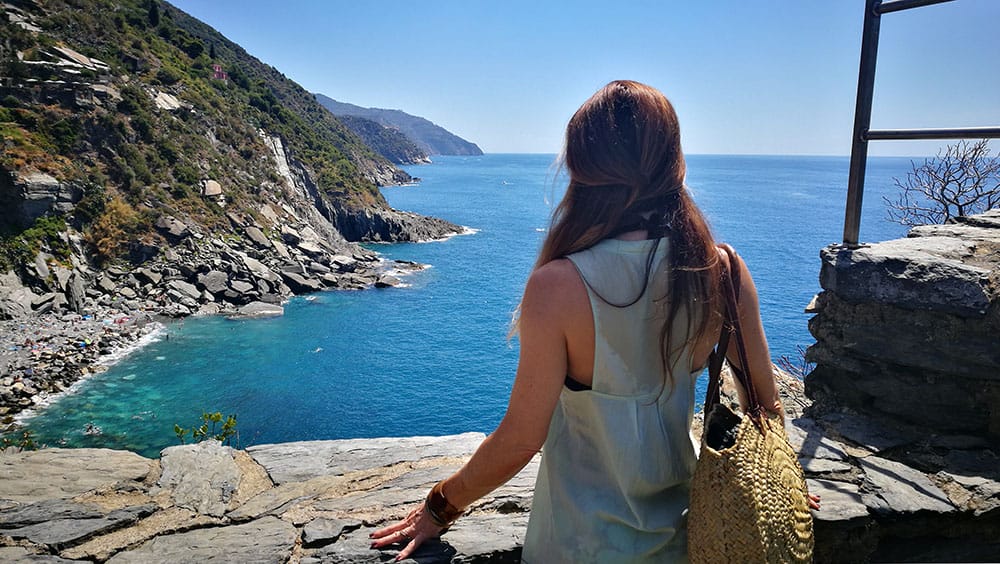 Photographer Scott Allen Wilson captures Shari from Sole Yoga Holidays looking upon the Ligurian Seaside from Vernazza Italy.