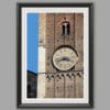 Black framed print of a detail of the clock tower of Palazzo del Governatore. Captured by Scott Allen Wilson