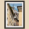 Black framed print of the Basilica of Parma peeking from a typical italian street. Shot by Photographer Scott Allen Wilson