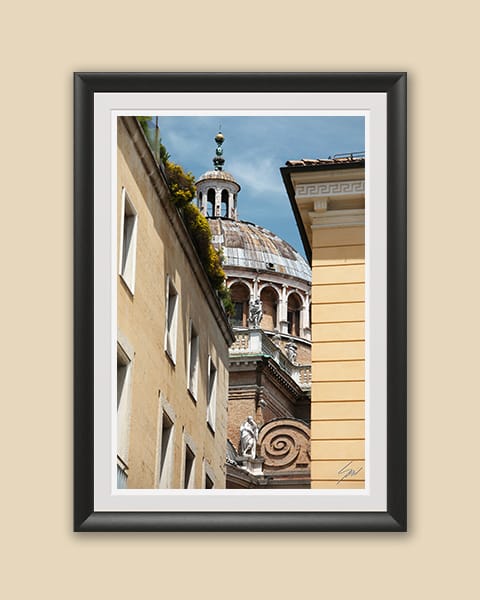 Black framed print of the Basilica of Parma peeking from a typical italian street. Shot by Photographer Scott Allen Wilson