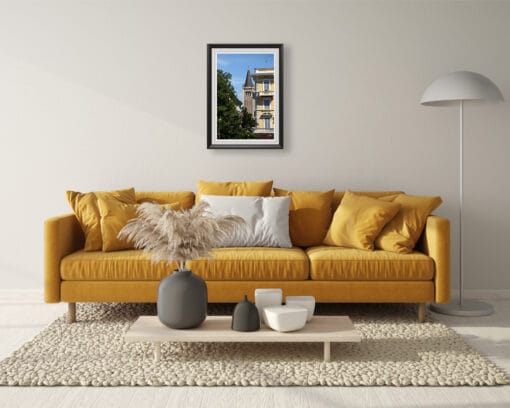 A print of Parma hung in a minimal living room with modern decor and a yellow sofa. By Photographer Scott Allen Wilson.