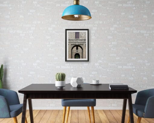 A print of the Pilotta palace in Parma hung in a modern room with a wooden pavement and industrial decor. By Photographer Scott Allen Wilson.