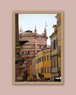 Wooden framed print of the pink marble Baptistery of Parma and the typical colorful houses of the city. Shot by Photographer Scott Allen Wilson