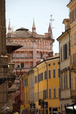 Print of the pink marble Baptistery of Parma and the typical colorful houses of the city. Shot by Photographer Scott Allen Wilson