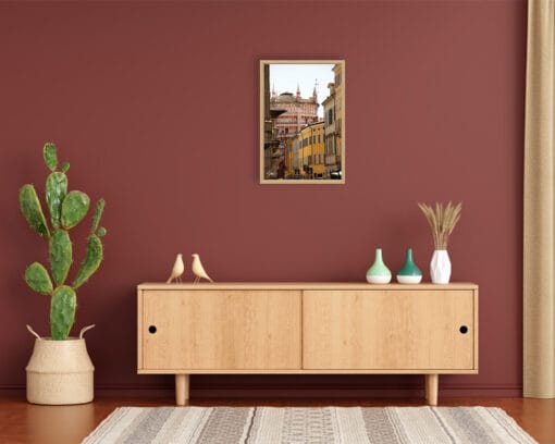 A print of the Baptistery of Parma hung in a minimal room with wooden decor. By Photographer Scott Allen Wilson.