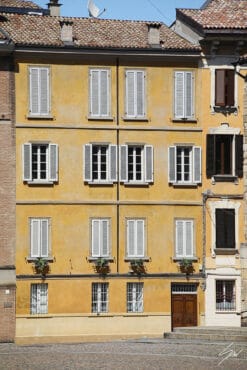 Print of a big yellow building with lots of windows in Parma. Created by Photographer Scott Allen Wilson