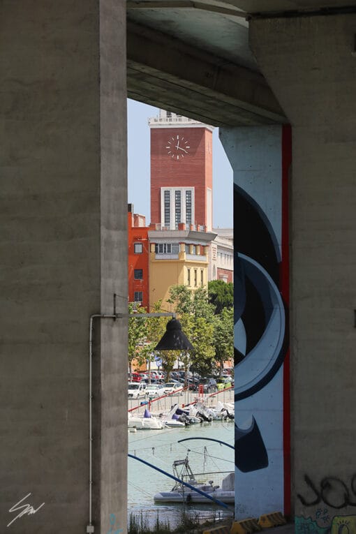 A square with a clock tower in Pescara, Italy. By Photographer Scott Allen Wilson.