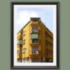 A black framed print of a symmetric yellow house in Pescara, Italy. By Photographer Scott Allen Wilson.