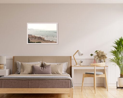 White framed print of a crowded beach in Pescara, Italy, hanging in a neutral colored living room. Shot by Photographer Scott Allen Wilson.