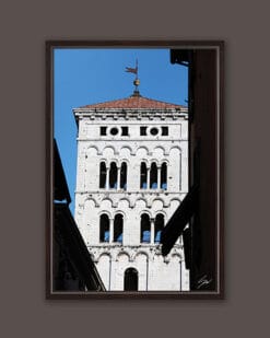A dark brown framed print of the clock tower of the Church of San Michele in Foro in the city of Lucca, Italy. By Photographer Scott Allen Wilson.