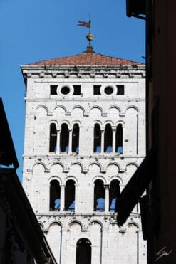 The clock tower of the Church of San Michele in Foro in the city of Lucca, Italy. By Photographer Scott Allen Wilson.