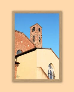 A wooden framed print of a red brick tower in Lucca, Italy. By Photographer Scott Allen Wilson.