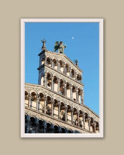 A white framed print of the Church of San Michele in Foro under the moon in the city of Lucca, Italy. By Photographer Scott Allen Wilson.