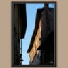 A black framed print of buildings in the city of Lucca, Italy. By Photographer Scott Allen Wilson.