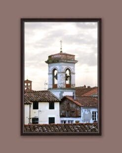 A dark brown framed print of a bell tower and red tiled rooftops in the city of Lucca, Italy. By Photographer Scott Allen Wilson.