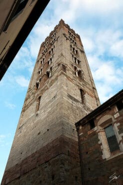 A brick tower in the city of Lucca, Italy. By Photographer Scott Allen Wilson.