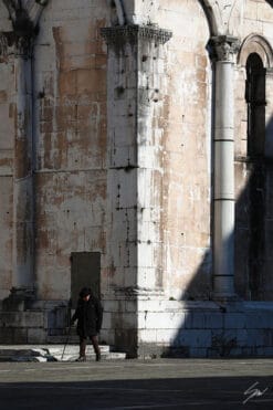 An old man is taking a stroll in Lucca, Italy. By Photographer Scott Allen Wilson.