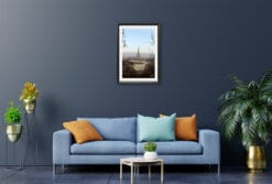 A black framed print of a view from a park in Torino, Italy, hanging in a modern living room. By Photographer Scott Allen Wilson.