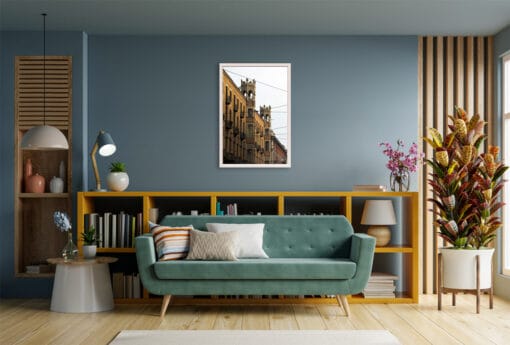 A white framed print of power lines in Torino, Italy, hanging in an hectic living room. By Photographer Scott Allen Wilson.