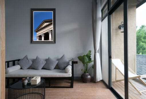 A black framed print of Gran Madre di Dio Church's façade in the city of Torino, Italy, hanging in a modern living room. By Photographer Scott Allen Wilson.