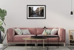 A black framed print of the heart of Torino, Italy, hanging in a modern living room. By Photographer Scott Allen Wilson.