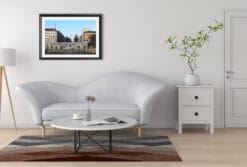 A black framed print of the banks of the river Po in Torino, Italy, hanging in a minimal living room. By Photographer Scott Allen Wilson.