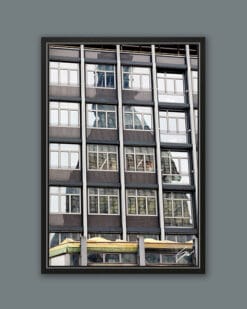 A black framed print of the Mole Antonelliana reflected in the glass façade of a modern building in Torino, Italy. By Photographer Scott Allen Wilson.