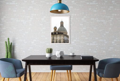 A white framed print of the Basilica Mauriziana in Torino, Italy, hanging in a modern kitchen. By Photographer Scott Allen Wilson.