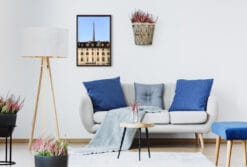 An ebony framed print of a cinematic view of Torino, Italy, hanging in a modern minimal living room. By Photographer Scott Allen Wilson.