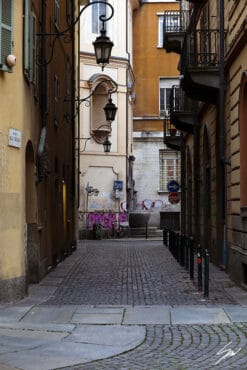 A cobblestone street in Torino, Italy. By Photographer Scott Allen Wilson.