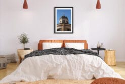 A black framed print of the Church of the Sacred Heart of Mary in Torino, Italy, hanging in a modern bedroom. By Photographer Scott Allen WIlson.