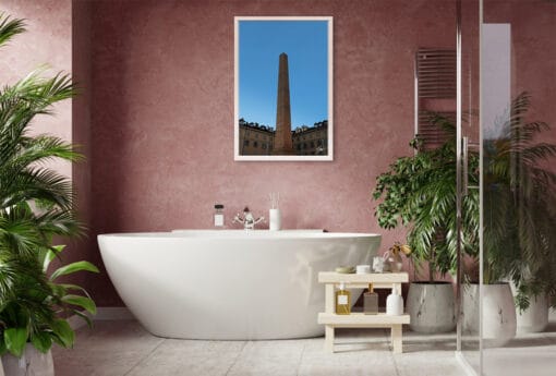 A white framed print of the obelisk in Torino, Italy, hanging in a boho bathroom. By Photographer Scott Allen Wilson.