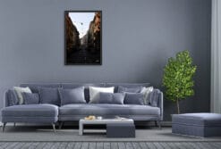 A black framed print of the streets of Turin, Italy, hanging in a modern living room. By Photographer Scott Allen Wilson.