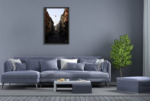 A black framed print of the streets of Turin, Italy, hanging in a modern living room. By Photographer Scott Allen Wilson.