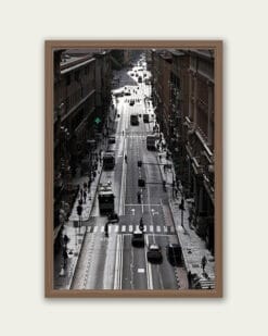 Wooden framed artwork by Travel Photographer Scott Allen Wilson, showcasing the interplay of light and dark within one of the main streets of Genova, Italy.