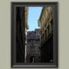 Wooden framed artwork by Travel Photographer Scott Allen Wilson, showcasing three historical buildings facing each other under a serene sky.