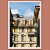 Wooden framed artistic print of a charming facade in the city of Genova, Italy, shining in earthy colors under the bright sun of noon.