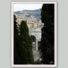 Wooden framed artistic print of a charming scenery in Genova, Italy, showcasing groups of residences and a white stone arch, immersed in nature. Photo captured by Travel Photographer Scott Allen Wilson.