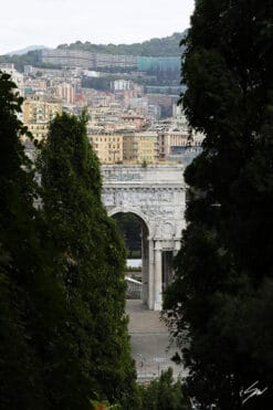 Elegant stone arch and clusters of houses surrounded by nature in Genova, Italy. Photo captured by Travel Photographer Scott Allen Wilson.