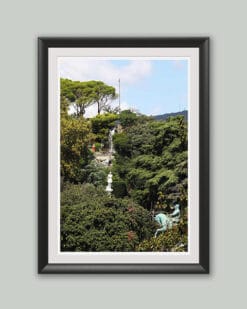 Wooden framed artistic print of a gorgeous landscape in Genova, Italy, showcasing two statues under a waterfall. Photo captured by Travel Photographer Scott Allen Wilson.