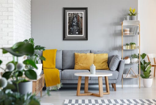 Green and yellow tones from the room decor create a striking contrast with the dark colors of this shot. In a brightly lit room, filled with color, this image would bring a perfect chromatic balance.