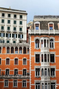 Finely decorated windows on a bright orange historical residence. Photo captured by Travel Photographer Scott Allen Wilson.