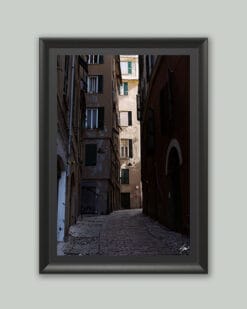 Wooden framed artistic print of a historical city alley, winding across imposing structures. Photo captured in Genova, Italy, by Travel Photographer Scott Allen Wilson.