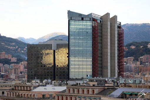 In this striking shot Travel Photographer Scott Allen Wilson captures history and modernity, both merging to create an exquisite contrast, where the glass facades reflect the surrounding buildings and the bright sunlight that shines on them.