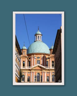 Wooden framed piece of art by Travel Photographer Scott Allen Wilson, showcasing a vibrant pastel colored structure surrounded by residential houses in the city of Genova, Italy.