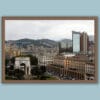 Wooden framed artistic print of a dazzling cityscape, featuring two main architectures: a historical grand arch and a modernistic glass skyscraper.