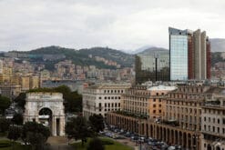 Patches of vegetation surround this rich cityscape, where a few monumental structures rise proudly. Photo captured in Genova, by Travel Photographer Scott Allen Wilson.