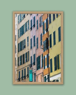 Wooden framed artistic print of a vivid shot, featuring a pastel colored house embellished by green shutters. Photo captured by Travel Photographer Scott Allen Wilson.